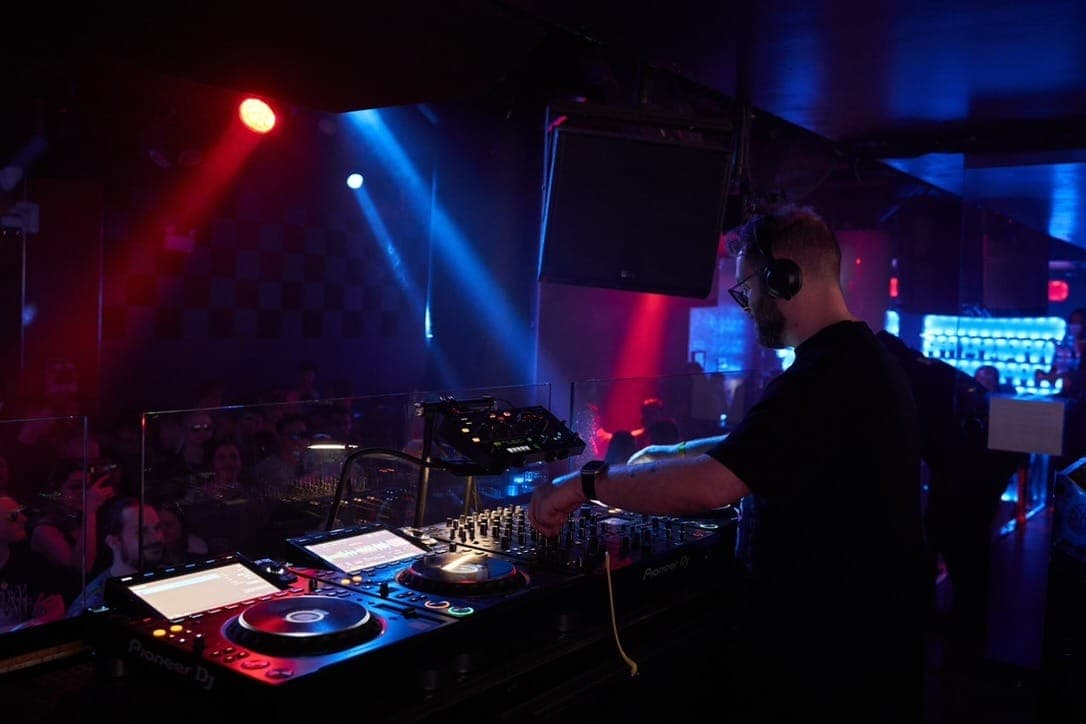 compil3r mixing in the booth at Sound-Bar, Chicago, opening for Qrion & Massane, March 2026
